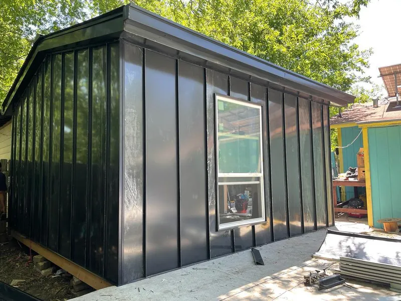 Black standing seam metal wall panels for Roof Inspection in Stanford